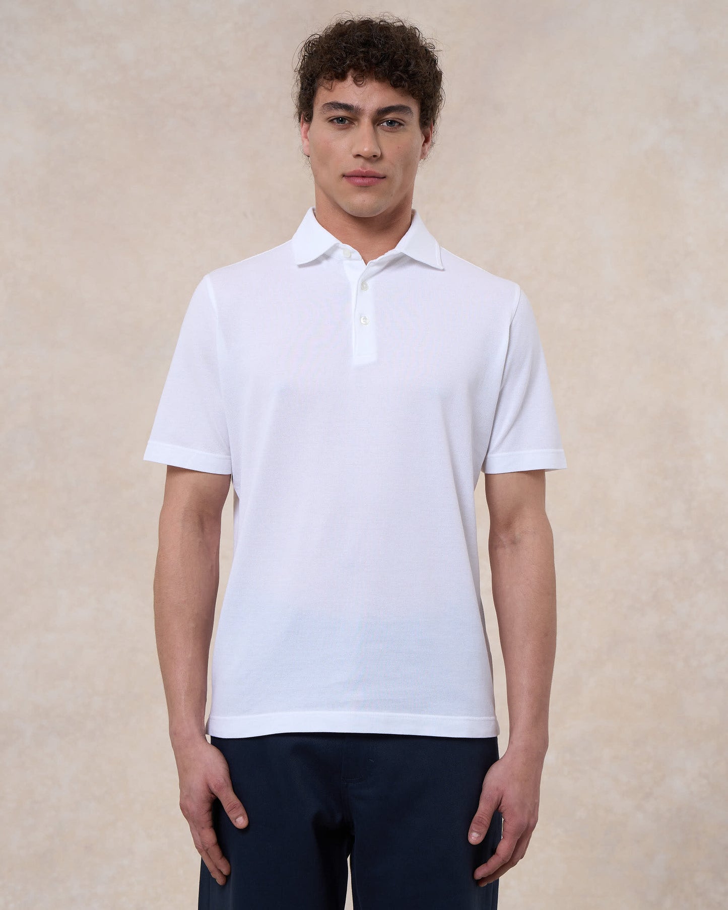 Polo bianco ottico in cotone piqué a manica corta