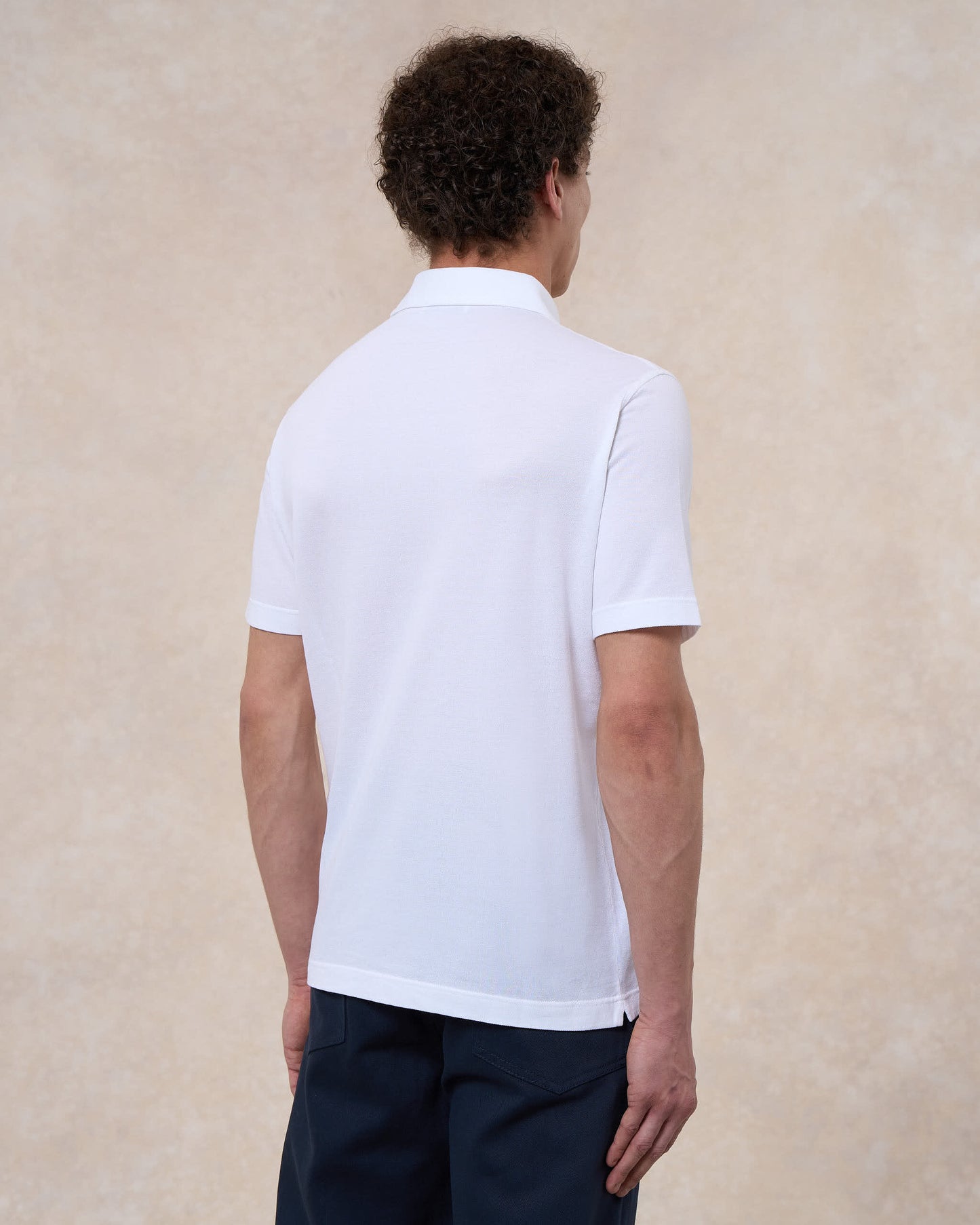 Polo bianco ottico in cotone piqué a manica corta