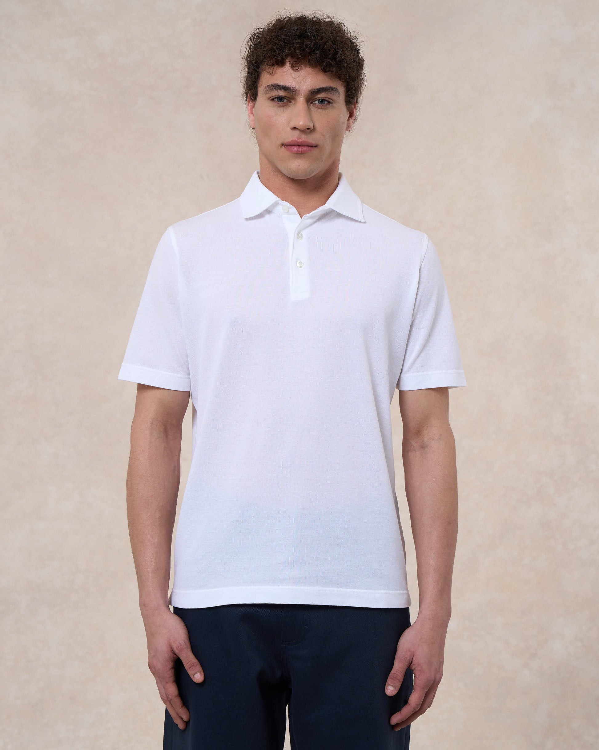 Polo bianco ottico in cotone piqué a manica corta