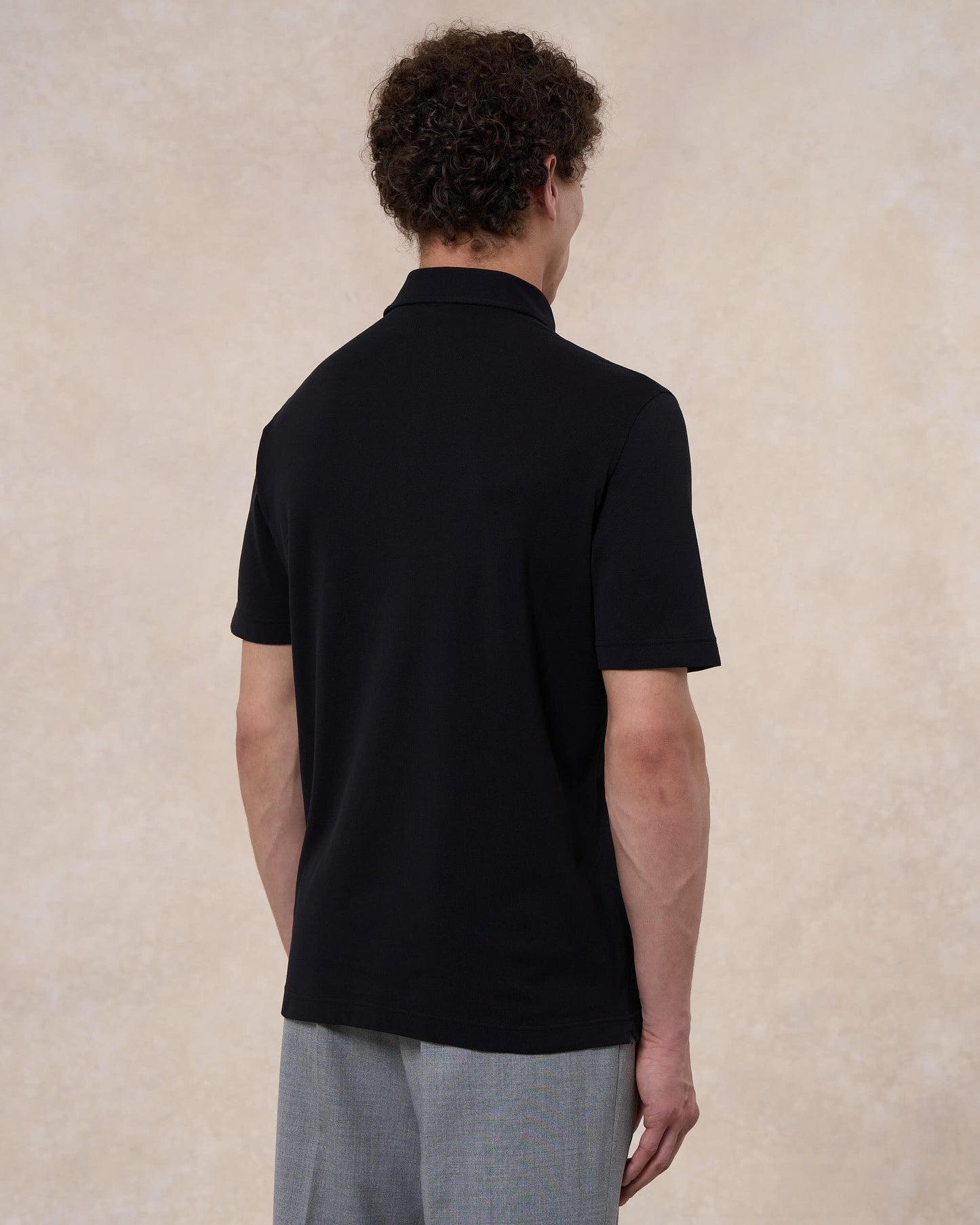 Polo nera in cotone piqué a manica corta